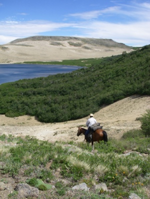 Reching Laguna chica on our crossing the andes Chile to Argentina on Horseback trail ride